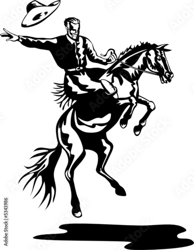 Rodeo cowboy riding a bucking bronco © patrimonio designs