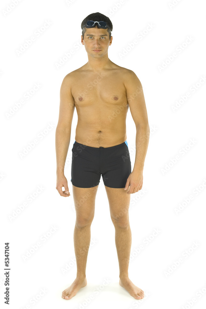 Young man dressed swimming trunks and goggles
