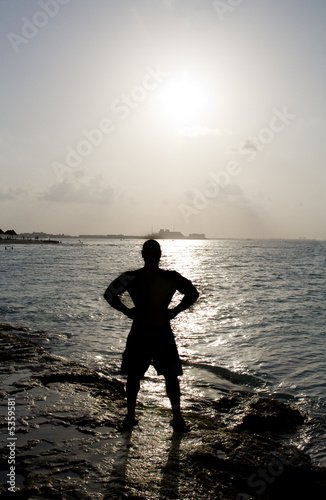 Silhouette of Man Posing Next to the Ocean