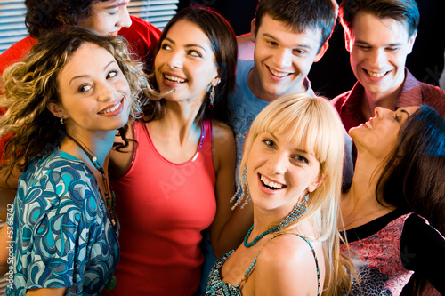 Happy group of people having an evening-party