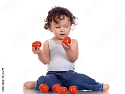 Child with tomato.