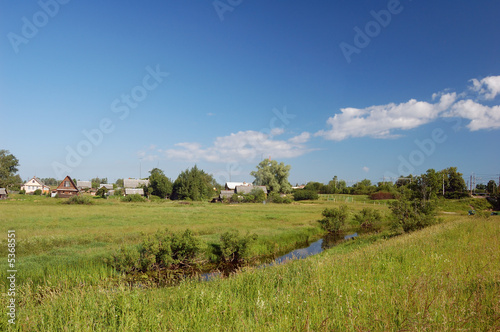 Canicular day  Field. Blue sky white clouds.