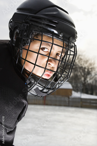 Ice hockey player boy. photo