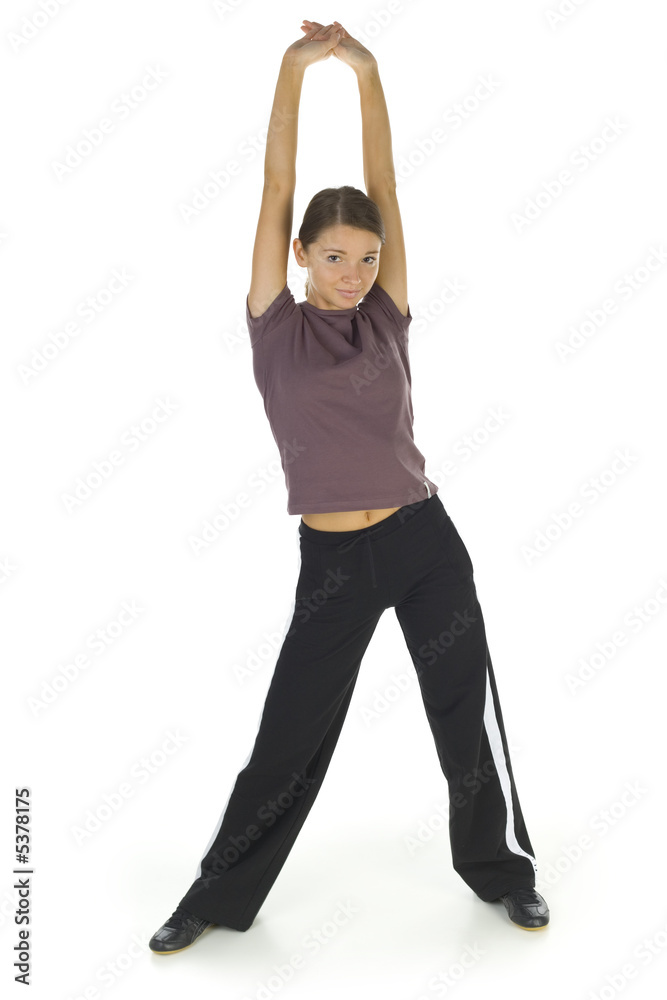 © Tomasz Trojanowski - Young, happy woman stretching and looking at camera