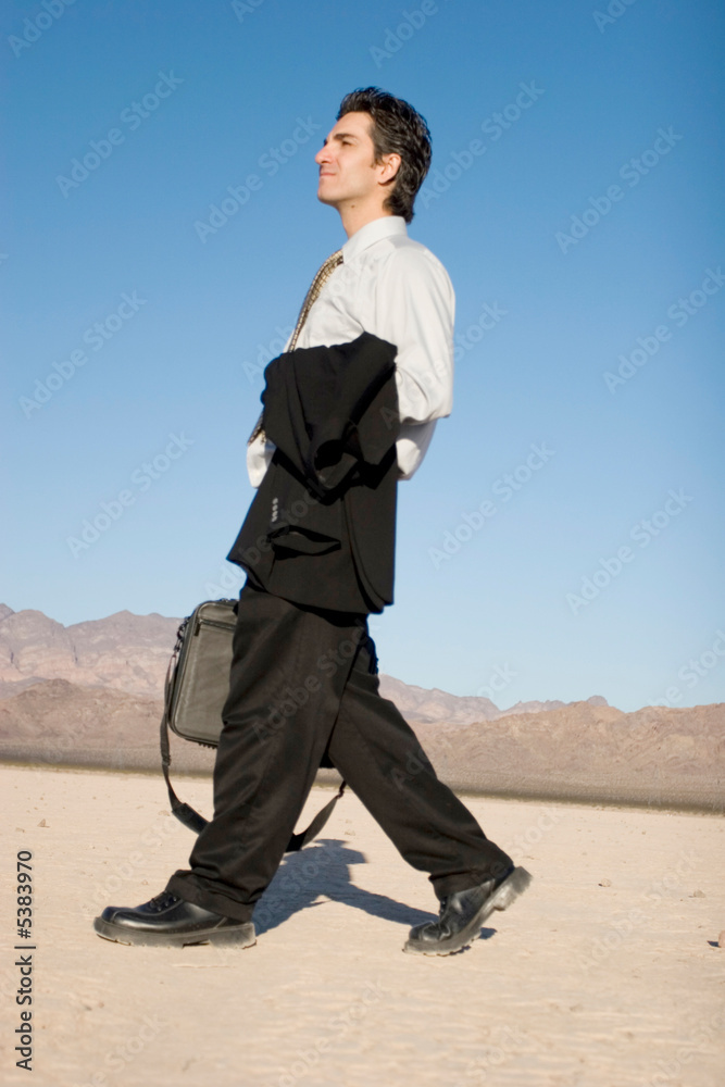 Businessman carrying his laptop case Businessman carrying his laptop case