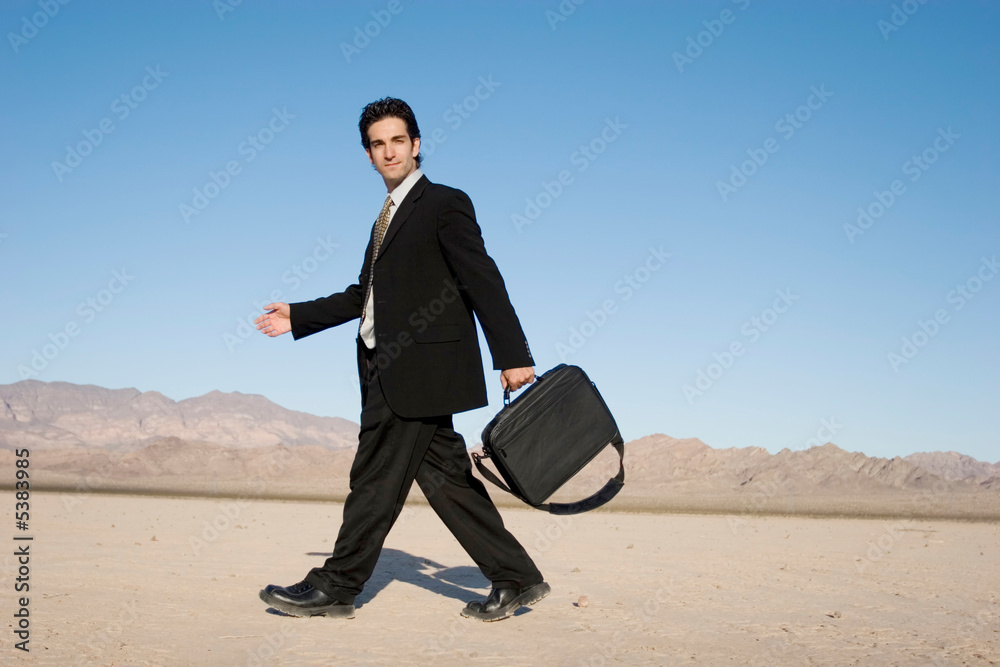 Businessman carrying his laptop case Businessman carrying his laptop case