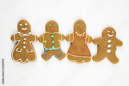 Gingerbread  cookies holding hands.