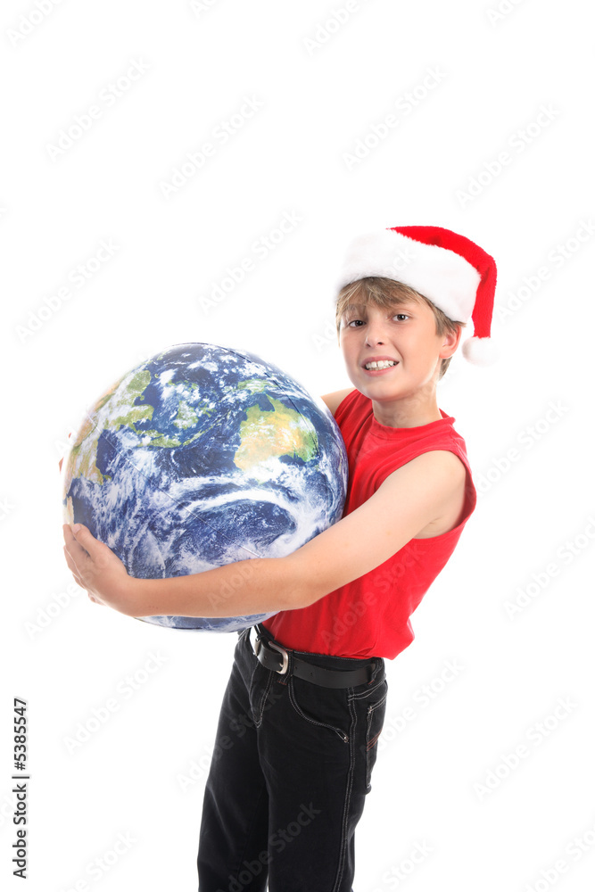 Boy holding globe. Embracing the love and joy of Christmas Boy holding globe. Embracing the love and joy of Christmas