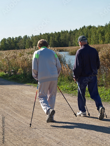 Two elderly men walking, view.