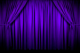 Large purple curtain with spot light and fading into dark.