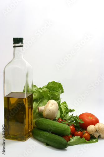 Fototapeta Naklejka Na Ścianę i Meble -  Olive oil in bottle,parsley, tomatom, mushroom,cucumber, fennel