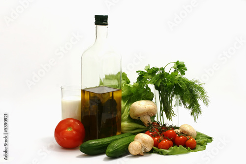 Fototapeta Naklejka Na Ścianę i Meble -  Olive oil,bottle,parsley,tomato,mushroom,cucumber,milk,lettuce