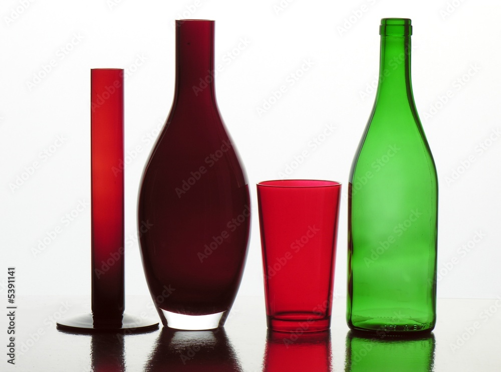 green bottle and red glass and vases