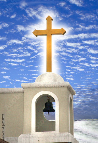A glowing orthodox cross with a very beautiful sky.
