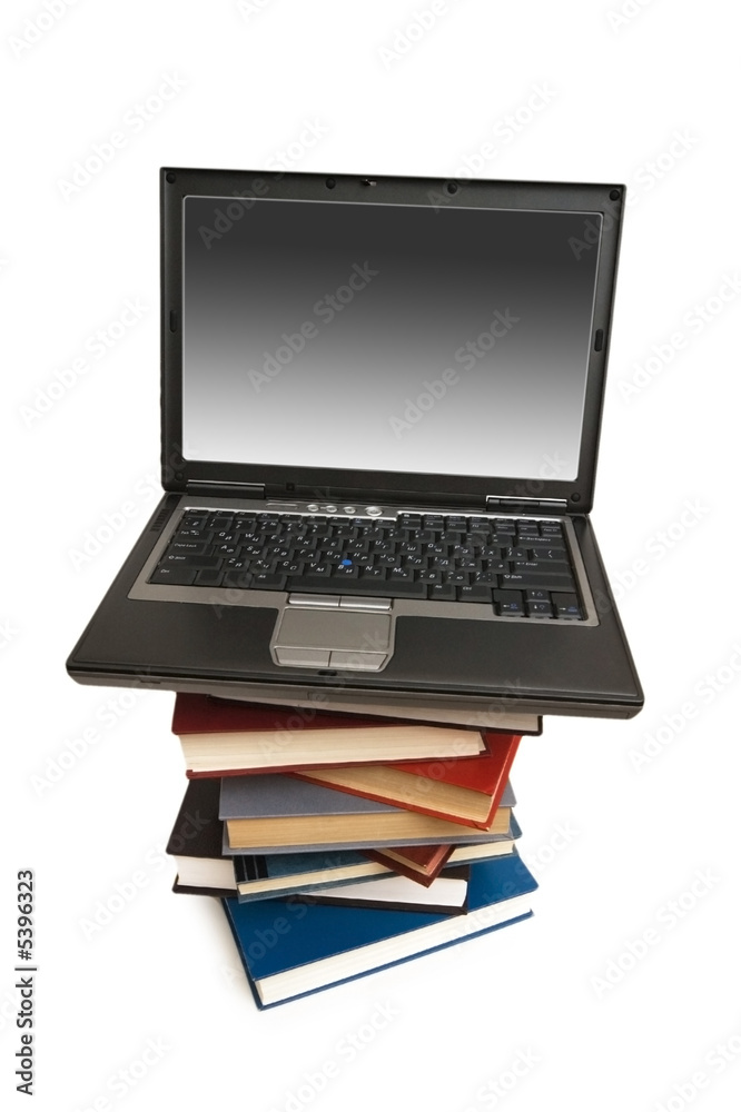 Concept illustrating evolution from books to computers Concept illustrating evolution from books to computers