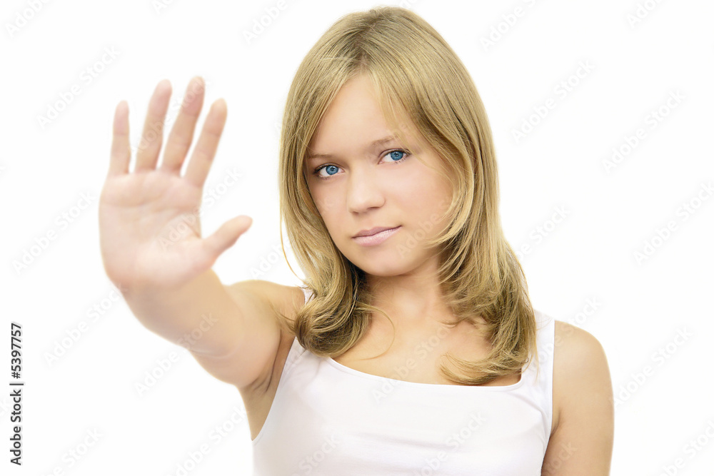 young beautiful serious girl making a stop sign young beautiful serious girl making a stop sign