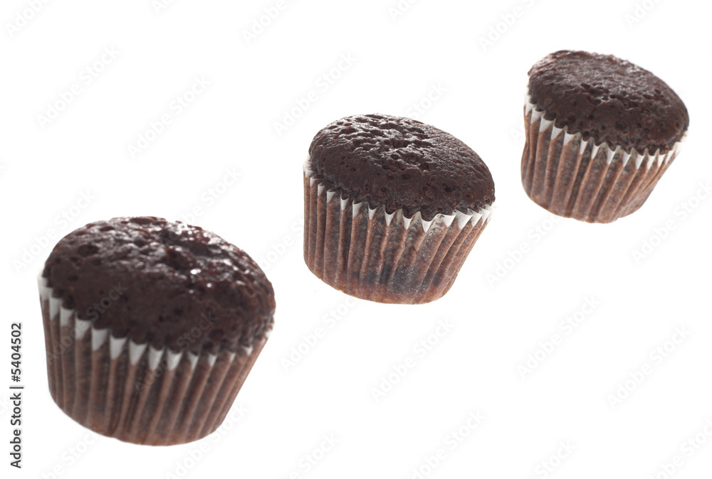 three chocolate muffin on white three chocolate muffin on white