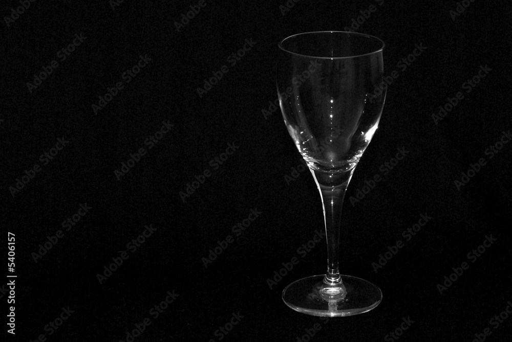 single wine glass shot against a black background single wine glass shot against a black background