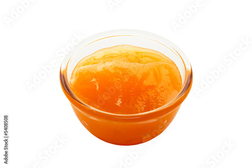 Honey in a glass bowl on white background