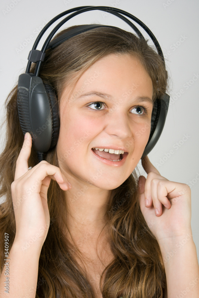 Fototapeta premium Young pretty girl singing.