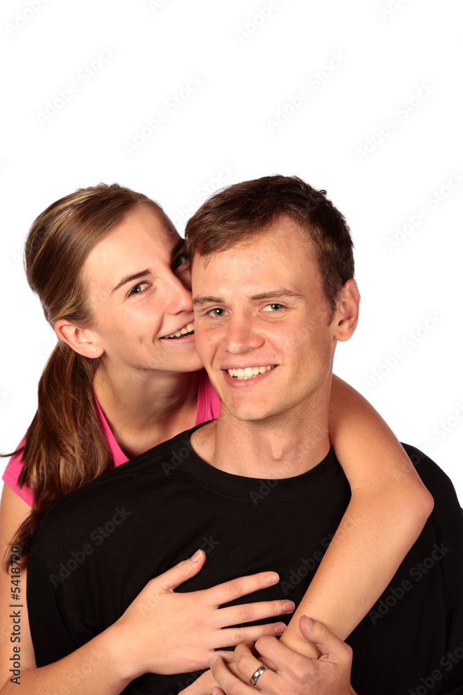 Young lady whispering something into partners ear Young lady whispering something into partners ear