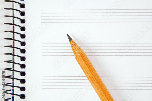 Blank music sheet and pencil