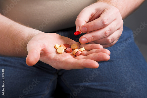Fototapeta man's hand with lot of different drug