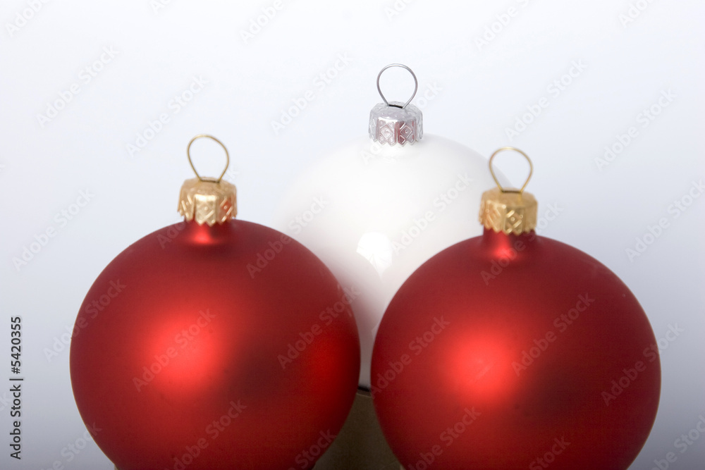 Christmas baubles, bows and garland on background Christmas baubles, bows and garland on background