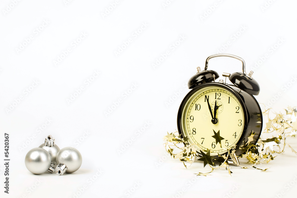 The clock is showing almost midnight on New Year night The clock is showing almost midnight on New Year night