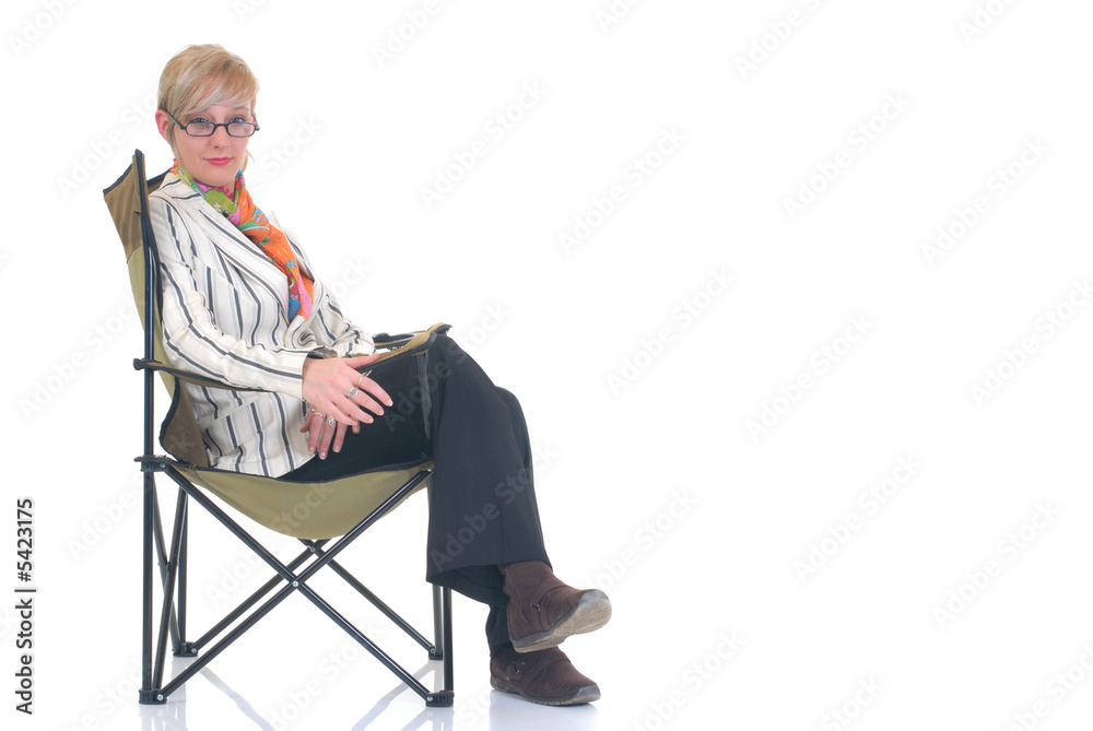 Attractive blond young businesswoman in director chair, Attractive blond young businesswoman in director chair,