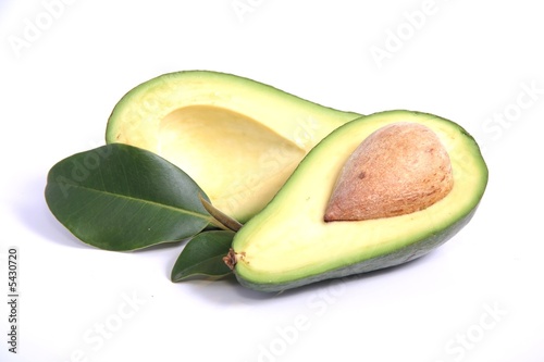 Avocado pear halves on white background photo