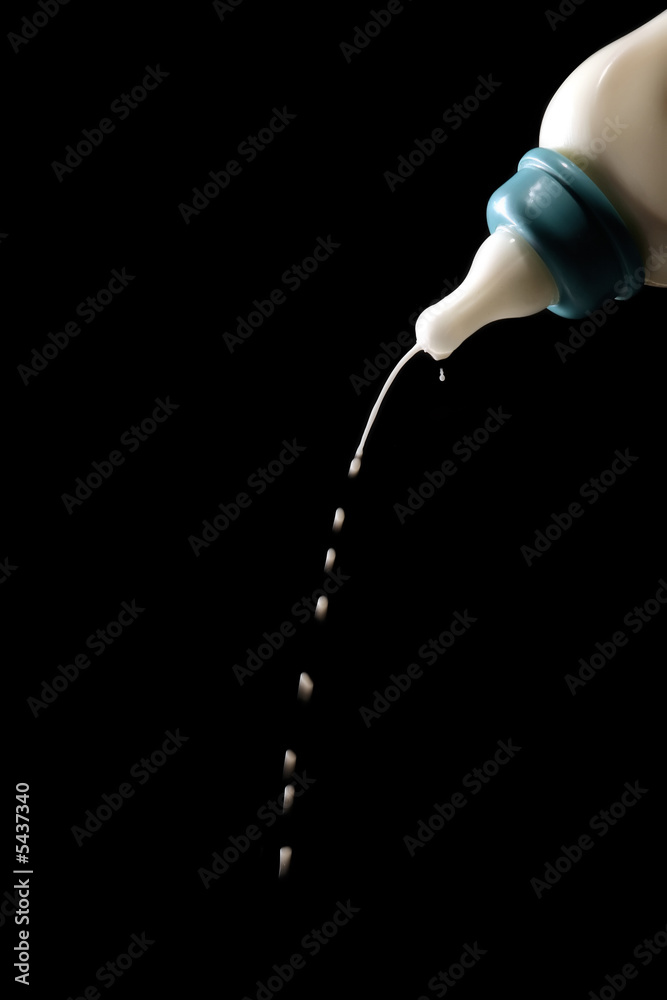 milk is droping from the baby bottle milk is droping from the baby bottle