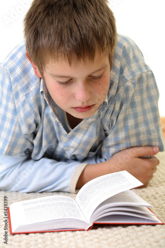 Boy learning on the floor.