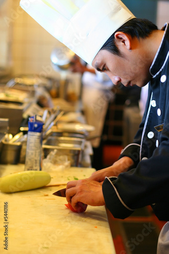 chef cooking, cutting in kitchen