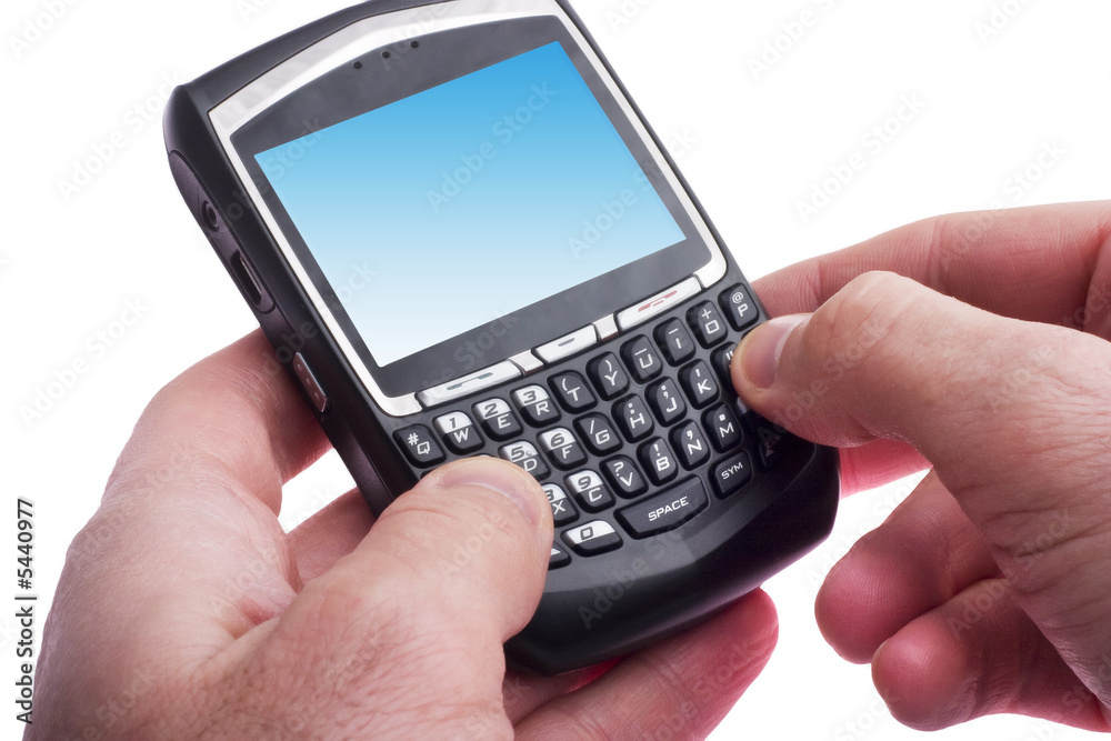 close up of hands typing on a Blackberry close up of hands typing on a Blackberry