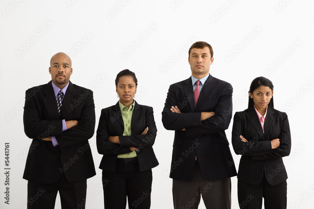 Businessmen and businesswomen standing looking serious. Businessmen and businesswomen standing looking serious.