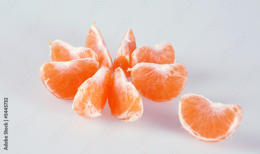 slices of tangerine on white background