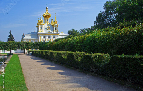 Building with gold domes in a garden