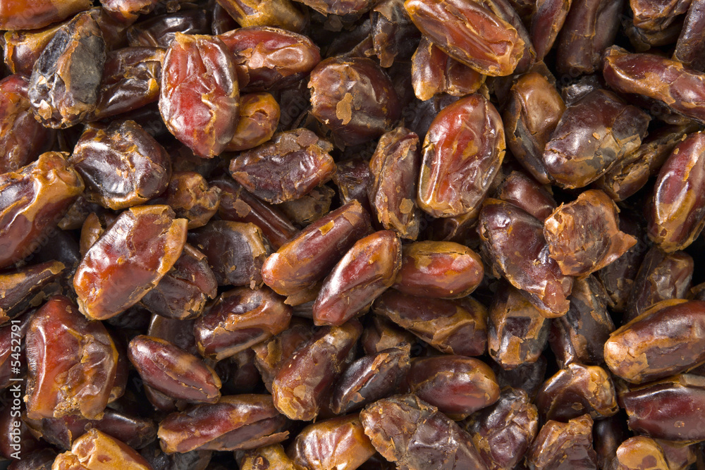 Textured background of pitted dates Textured background of pitted dates