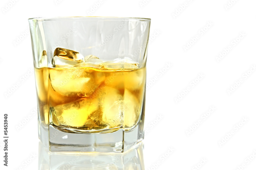 Whiskey on ice, reflected on white surface.