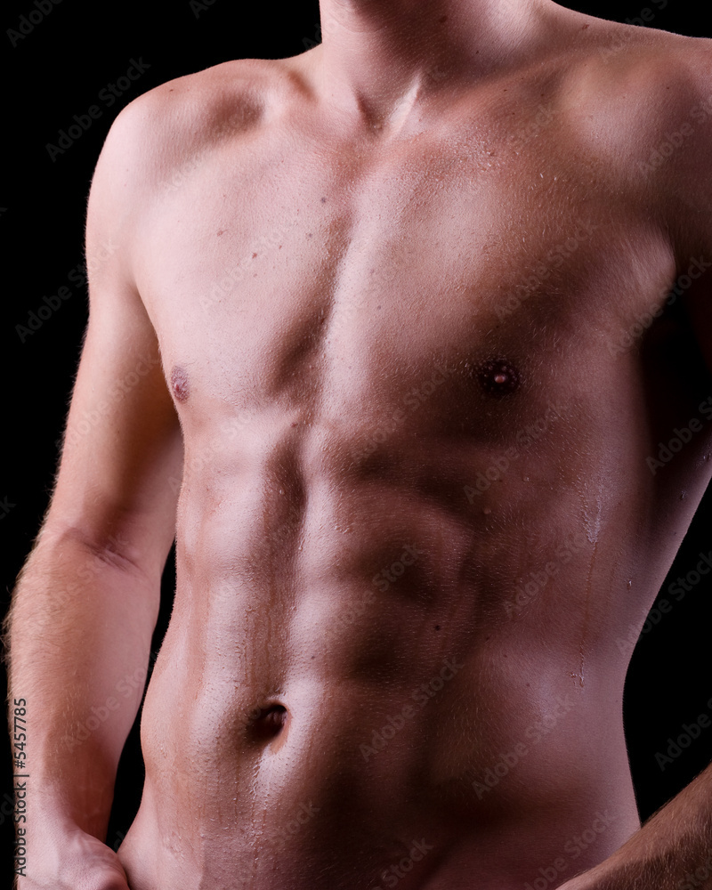 Fototapeta premium Torso mit Schweiss auf Waschbrettbauch