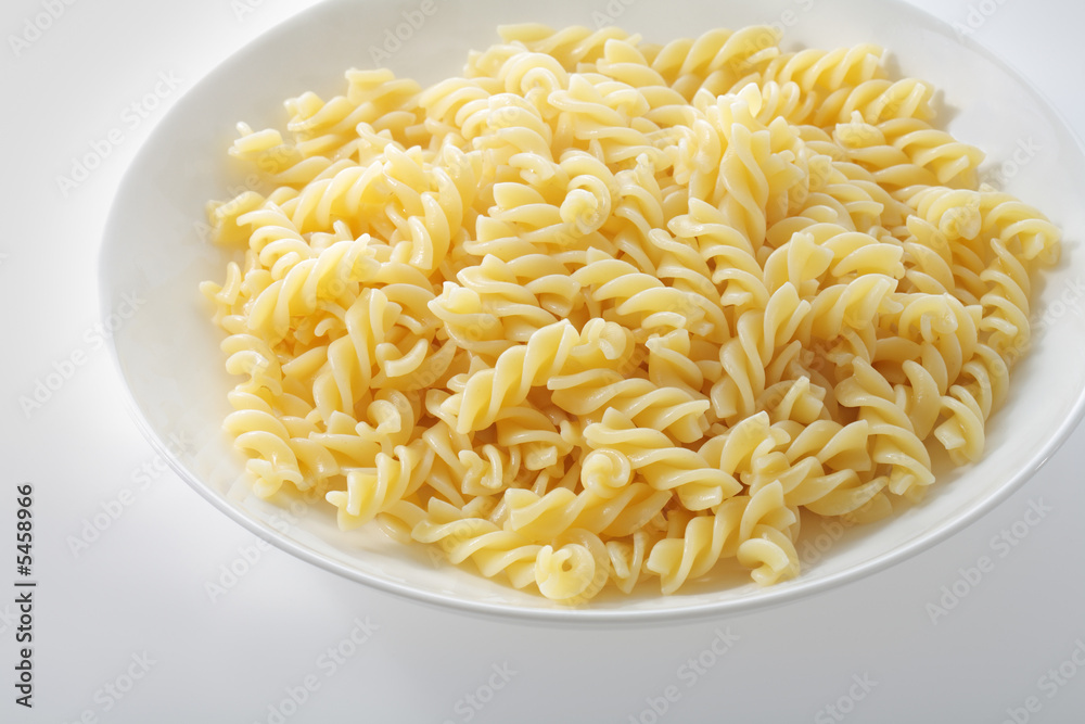 A plate with cooked pasta fusilli