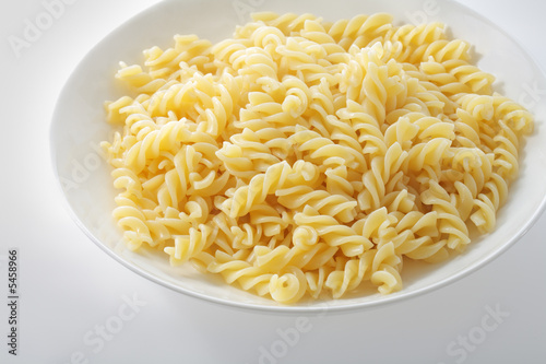 Fotografie A plate with cooked pasta fusilli