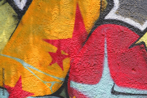 Colorful graffiti with shadows-detail on a wall.