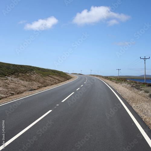 bend on deserted road on North Uist Outer Hebrides Scotland