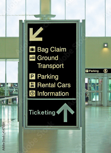 airport sign for bag claim transport ticketing information