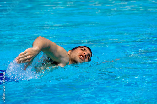 Man swimming in pool. Water sports concept