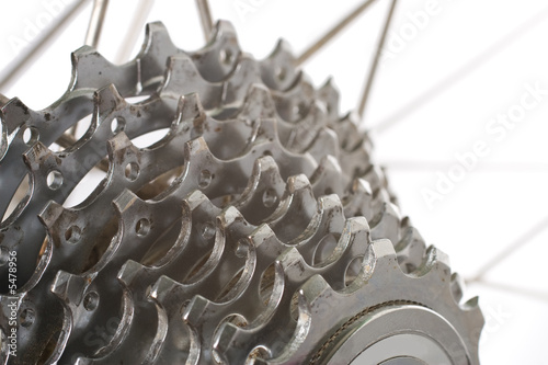 A worn nine speed bicycle chain gear cassette photo