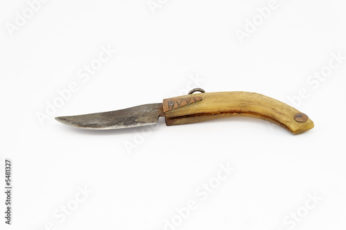 old knife with handle make by horn isolated on white