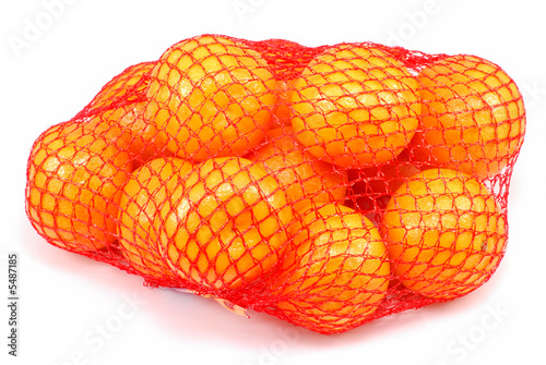 Fresh tangerines in a netted bag